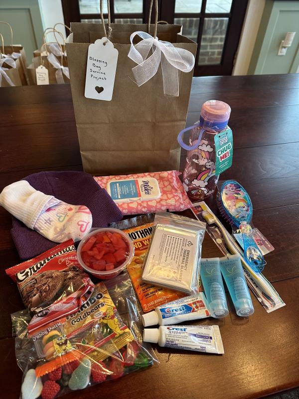 Children’s bags included wipes and hats instead of gloves.